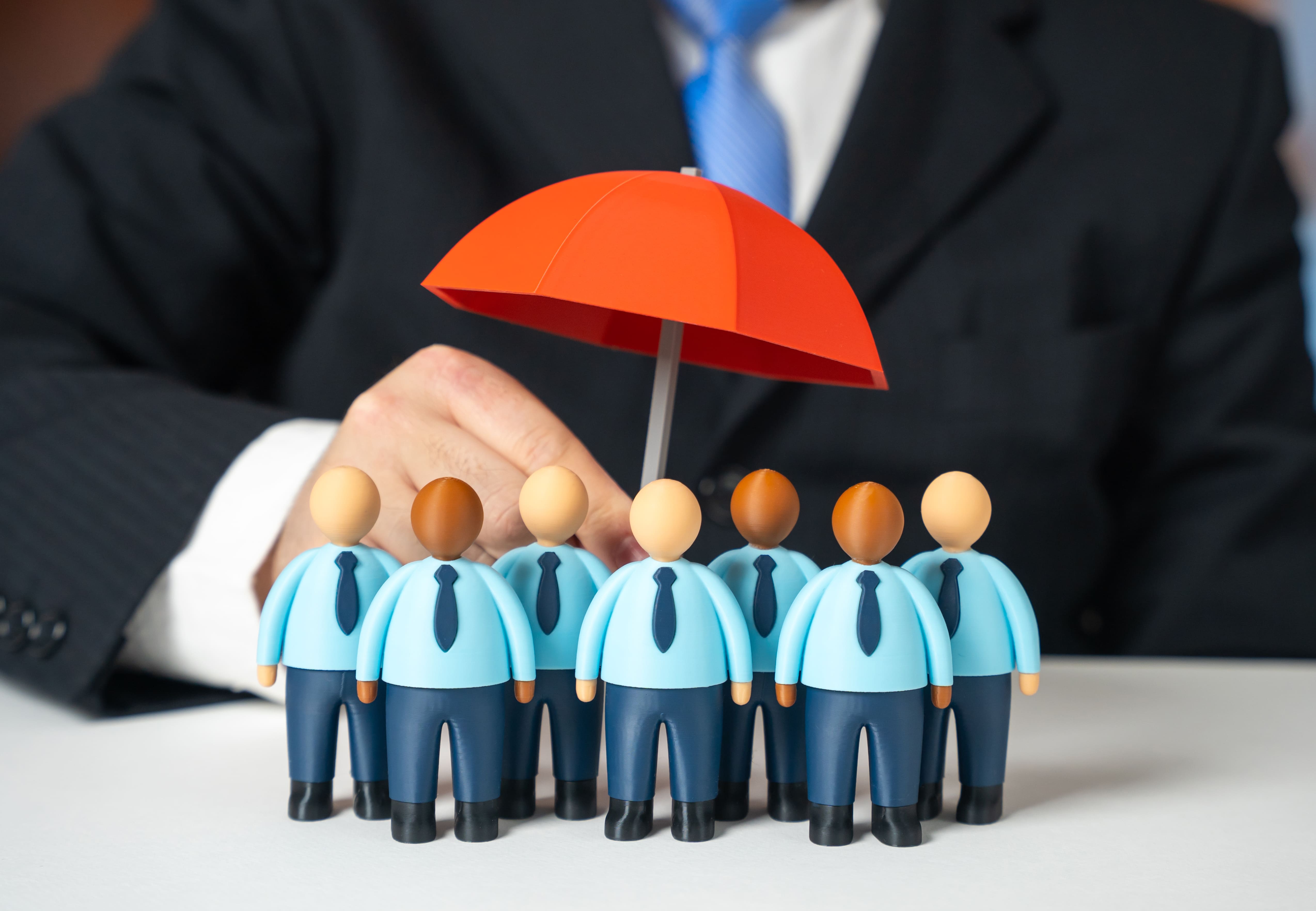 business team insurance. investor protection. businessmen under an umbrella